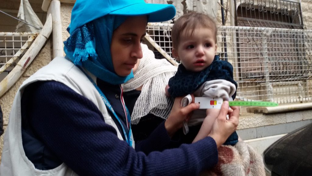 [CROPPING OF THIS PHOTOGRAPH IS NOT PERMITTED] On 14 January 2016, a child is screened for malnutrition at a make-shift hospital in Madaya. The UNICEF team and staff of the World Health Organisation were able to screen 25 children under five for malnutrition using the Mid-Upper Arm Circumference measurement. Twenty-two (22) of the children showed signs of moderate to severe malnutrition. All of these children are now receiving treatment at the health facility using specialized medical and nutrition supplies that the UN and ICRC delivered on Monday. The team screened another 10 children aged from 6 to 18. Six of them showed signs of severe malnutrition. UNICEF Representative in Syria Hanaa Singer said UNICEF welcomes the access granted to trapped children this week and can confirm that cases of severe malnutrition were found among children in the besieged Syrian town of Madaya following our participation in the second joint UN/Syrian Arab Red Crescent/ICRC humanitarian mission to the area on Thursday. As part of the convoy on 14 January, 24 UNICEF trucks delivered blankets, childrens winter clothes, diarrheal disease kits, midwifery kits, and emergency health kits for 10,000 people. Additional supplies included school bags for 12,000 children, hygiene supplies including washing powder, soap, shampoo, water purification tablets. A previous delivery on Monday 11 January included therapeutic and other nutrition supplies that included multiple micronutrients, high energy biscuits and therapeutic food and medication for the treatment of severe and acute malnutrition.