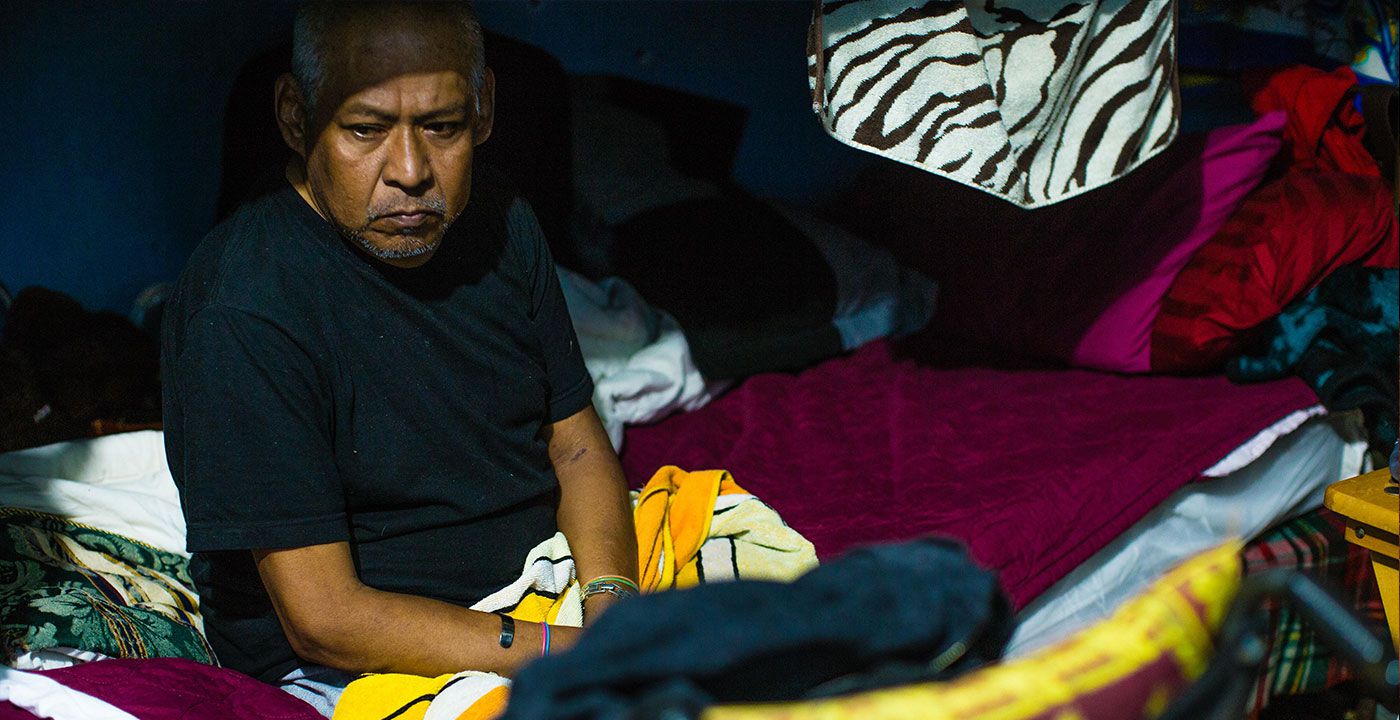 'They Live Here, Now': Refugee Teo sits thoughtfully before lights out at the Austin-based refugee house, Casa Marianella. Photo: Jason Outenreath