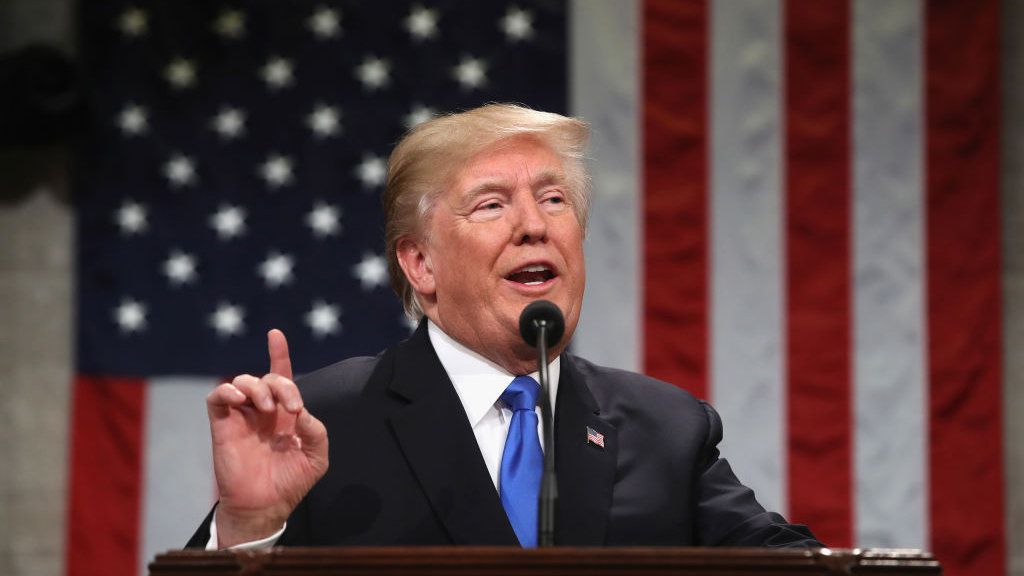 President Trump is pictured in front of the American flag during the 2018 State of the Union Address
