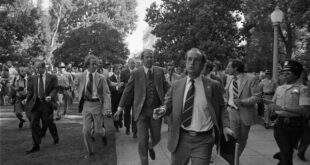 Photograph of Secret Service Agents Rushing President Gerald Ford towards the California State Capitol following the Assassination Attempt on the President by Lynette "Squeaky" Fromme, in Sacramento, California, Sept. 5, 1975. Photo from the National Archives and Records Adminstration via Wikimedia Commons